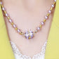 Elegant halskjede i perleimitasjon med glitrende magnetisk rhinestone-kule